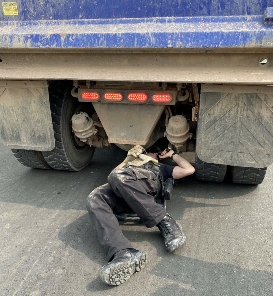 An officer inspects a truck