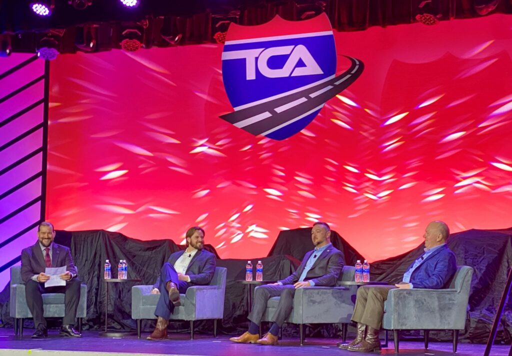 Four men sitting on stage during Truckload 2024